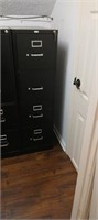 Metal file cabinet has keys