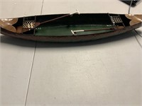 23 inch long canoe with 2 ores