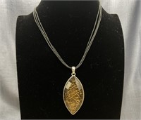 Brown Oval Shaped Pendant on a Black Cord