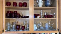Contents of kitchen cabinet- glasses, pitchers,