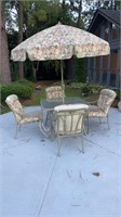 Patio seat with cushions and umbrella and