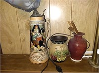 Red vase, candle warmer, and a stein