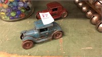 Pair of arcade toys red and blue cars