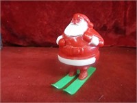 Vintage plastic Santa candy container on skis.