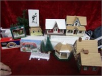 Christmas Village houses, figures, trees.