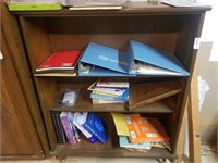 3 shelf bookcase with binders, assorted books