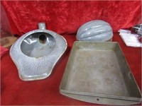Graniteware pieces and metal pans.