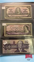 binder w/ 3 $10 Canadian bills