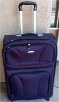 818 - SOFT-SIDE SUITCASE ON WHEELS