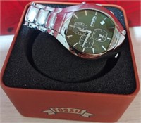 818 - SILVER FOSSIL WATCH W/GREEN FACE