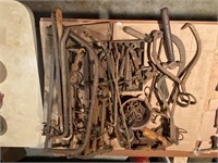 table lot of early iron-ice tongs, hooks and more