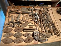 table lot -sad irons, trivets, tools & more