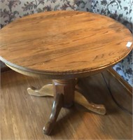 Oak Dining room table 

42” round 
has one