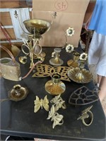 BOX FULL OF BRASS CANDLE HOLDERS