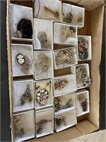 BOX FULL OF COSTUME BROACHES AND EARRINGS
