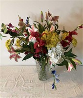 Floral arrangement in 10” glass vase