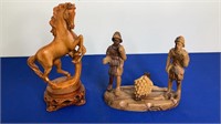 Hand carved horse statue with wooden display