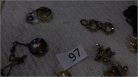 25- sets earrings & 1 heart locket