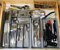 Silverware and various kitchen utensils.