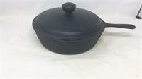 Unmarked iron skillet with lid