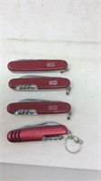 Four Swiss Army style knives