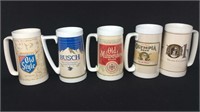 Five assorted beer mugs