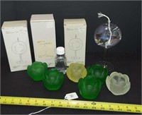COLORED GLASS VOTIVES AND HAND BLOWN OIL LAMPS.