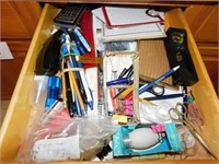 Contents of drawer: Note pads, pens , pencils,