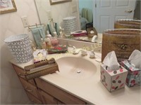 all bathroom supplies on vanity trash can tissue
