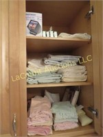 assorted towels sheets misc bathroom items