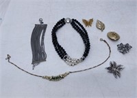lot of necklaces, pins, bracelet