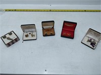lot of cufflinks and items