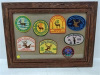 lot of deer hunting badges in frame
