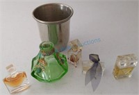 Perfume bottles and a pewter cup