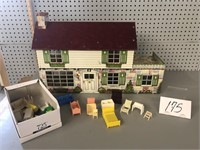 TIN DOLL HOUSE WITH PLASTIC FURITURE