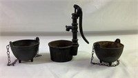 Three small cast-iron pots