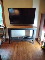 Sony TV wall mounted. Pine table and Sony DVD