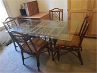 Rattan and glass dining table