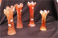 Four marigold carnival glass vases ranging