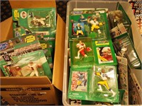 A box and a container of Starting Lineup NFL