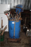 barrel of garden tools