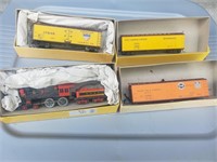 3 box cars. 1 locomotive and Coal car