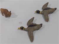 (AB) 2 duck figurines and 1 buffalo figurine