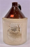 Brown and white jug - "Malaga Wine" paper label,