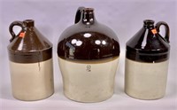 3 jugs, brown and white, 2 gallon & two 1 gallon