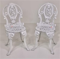 Pr. Cast iron chairs, painted white, shield backs,