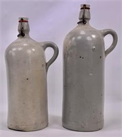 2 stoneware bottles, clamp tops, 4" and 4.5" dia.,