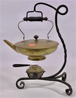 Brass tea kettle in wrought iron frame, brass
