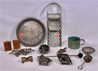 Kitchen items: cheese grater, tin cup, cookie