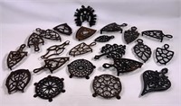 Iron trivets for flat irons, old and newer.